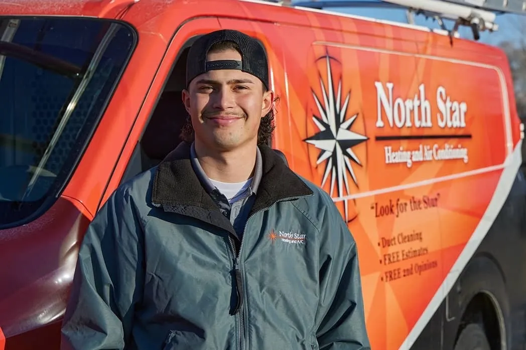 Professional North Star technician standing by service van